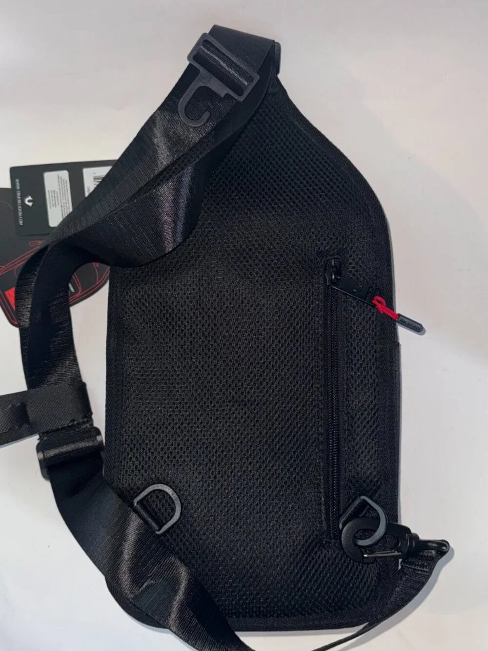 True Religion Sling Bag Features a Textured Brand Patch Durable Nylon With Red
